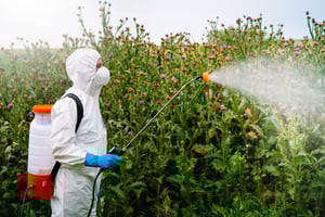 High shear mixer dispersing agrochemical ingredients
